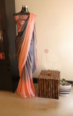 Beautiful combination of Peach and Grey in butter chiffon Saree given silver piping . Blouse - Heavy beadwork with chikankari and tube embroidery.  For booking and inquiry,visit us at www.facebook.com/maneeti or whatsapp on 9539820656   #maneeti #maneetidesigners # chikankari #designersarees #chiffonsaree #butterchiffon #indiansaree #indianwoman #beadworks Sarees Styles, Synthetic Saree, Synthetic Sarees, Piping Blouse, Dress Batik Kombinasi, Saree Drapes, Farewell Sarees, Saree Blouse Styles, Saree Draping Styles