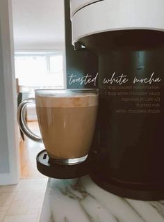 a coffee cup sitting on top of a counter