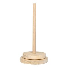 a wooden toothbrush holder on a white background