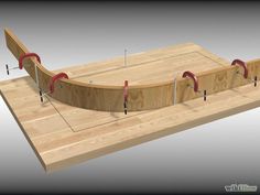 a wooden skateboard ramp with red handles