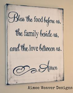 a sign that says, be the food before us, the family beside us, and the love between us
