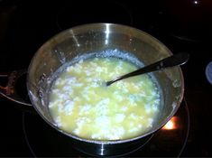 a pan filled with food sitting on top of a stove next to a burner