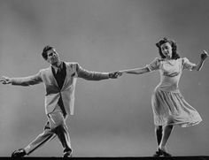 a man and woman are dancing together in an old black and white photo with the caption life magazine