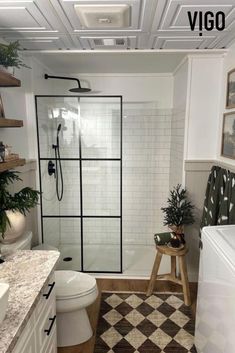 a white bathroom with black and brown accents