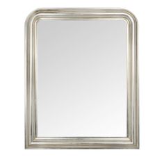 a silver framed mirror on a white wall