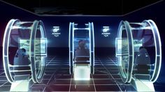 a futuristic looking room with some people in it