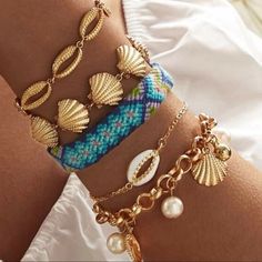 Gold-Plated Puka Shell With Faux Pearl Accents Includes All Bracelets Shown. Sold As A Set Only. 20% Polyester, 60% Alloy, 20% Faux Pearl Motorcycle Chain Bracelet, Les Pogues, Beaded Shell, Blue Stone Bracelet, Gold Stretch Bracelet, Jewelry Product Shots, Faith Bracelet, Puka Shell