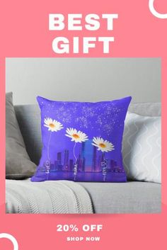 a pillow with daisies on it and the text, best gift 20 % off shop now