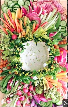 an arrangement of vegetables arranged on a cutting board