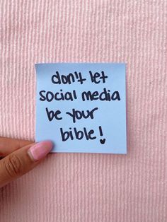 someone holding up a piece of paper with the words don't let social media be your bible