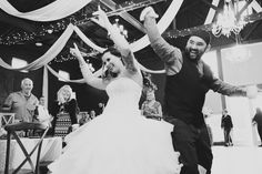 a bride and groom dancing at their wedding reception