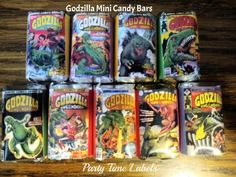 godzilla mini candy bars are lined up on a table with the words godzilla in front of them