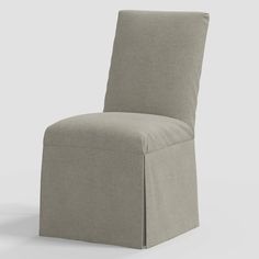 a gray chair that is upholstered with fabric