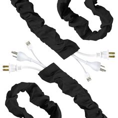 two black scrunffles with white cords attached to each other and one cord is plugged into the charger