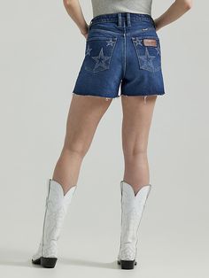 THE STAR OF ANY OUTFIT Add some extra pep to every step you take this summer with the Women’s Wrangler Retro® Bailey High-Rise Star Patch Shorts. Flattering from every angle, these denim shorts come with a high-rise silhouette, regular fit, and 3 1/2” inseam. They’re crafted from a comfy cotton blend with just a hint of stretch. These shorts also come fully loaded with our signature five-pocket styling, a branded patch, a lasered star print on the pockets, and a raw hem. Britney Spears Workout, 2024 Clothes, Short Cowgirl Boots, Patch Shorts, Casual Goth, Wrangler Shorts, Boho Grunge, Women Short Skirt, Y2k Streetwear