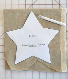 a piece of paper with a star cut out on it