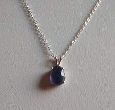 18 in genuine iolite pendant with sterling 1.7 mm cable link chain sterling spring ring clasp Iolite is indigo blue color with violet undertones, natural color, 10 x 8 mm approx 1/2 x 3/8 in pendant 16 x 8 mm approx  6/8 x 3/8 in all silver is 925 sterling Iolite Necklace, Amethyst Bracelet, Gold Filled Jewelry, Indigo Blue, Necklace Pendant, Link Chain, Spring Rings, Natural Color, Silver Chain