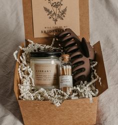 Say Will you be my bridesmaid? in style with this dark academia bridesmaid proposal gift box! Show your favorite bookish friends how much you appreciate their help with this thoughtful combo, featuring one Grace + Bloom literary-themed candle for them to light while they read, a decorative glass bottle of white-tipped matches, a cute claw clip to keep their hair back, and a custom-designed Will you be my... card that doubles as a bookmark Fall Bonfire, Personal Attendant, Literary Candles, Match Bottle, Shop Inspiration, Spiced Cider, Candle Matches, Glass Bottles Decoration, Cadeau Diy