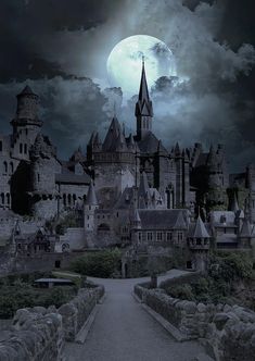 an old castle with a full moon in the background