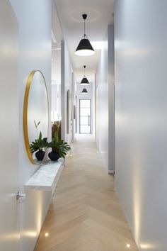 the hallway is clean and ready for us to use as an entrance way in this modern home