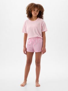 Soft knit PJ set.  Crewneck.  Short sleeves.  Elasticized waist at PJ shorts.  Allover print.  This PJ set is made with 100% recycled polyester.  Less waste in the world.  More great clothes for you.  Straight, easy fit.  Easy pull-on waist. Pj Shorts Set, Shorts Pajamas, Christmas Nightwear, Pj Shorts, Pink Pajamas, Short Pj Set, Petite Jeans, Print Shorts, Gap Kids
