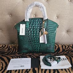 This Lush Handbag Is A Must Have! Handbag Features Rich Shades Of Green In An Ombre Pattern. This Handbag Will Definitely Elevate Your Style To The Next Level ( I Might Be A Little Bias As Green Is My Favorite Color :) Currently, This Handbag Is Unavailable To Purchase Online And In Stores. Includes Registration Card, Brahmin Card, Detachable Strap, And Dust Bag As Pictured. Comes From A Smoke/Pet Free Home. Matching Veronica Wallet Is Available In My Other Listings Brahmin Large Duxbury Feature Green Is My Favorite Color, Rainbow Snake, Ombre Pattern, Brahmin Bags, Brahmin Handbags, Croc Leather, My Favorite Color, Croc Charms, Credit Card Wallet