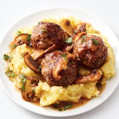 some meatballs and mashed potatoes on a white plate