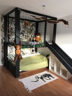 there is a bunk bed in the room with stuffed animals on it and stairs leading up