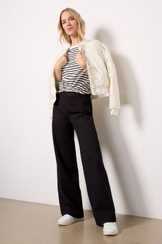 Ideal for work or weekend, The Perfect Pant by Spanx features a wide leg silhouette in smoothing, premium four-way stretch ponte fabric with hidden core shaping technology. These pants pull on seamlessly without a zipper or button. Dress them up with a blouse and booties, or pair with a pullover and sneakers for a chic everyday look. Straight Leg Work Pants, Trouser With Sneakers Women, Work Outfit With Black Pants, Wide Leg Pants With Tennis Shoes, Trouser Sneakers Outfit, Black Pants And Sneakers Outfit, Trouser And Sneakers Outfit Women, Dress Pants And Sneakers, Dress Pants With Sneakers