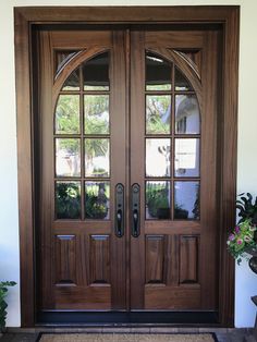 a pair of double doors with arched glass