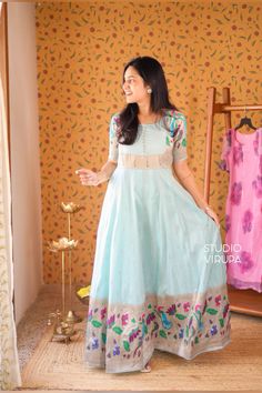 This semi silk Paithani dress is a perfect traditional attire for functions and temple visits. Its elegant and versatile style suits various occasions, adding a touch of cultural beauty to your wardrobe. Blue Dress