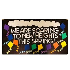 a sign that says we are soaring to new heights this spring with colorful kites