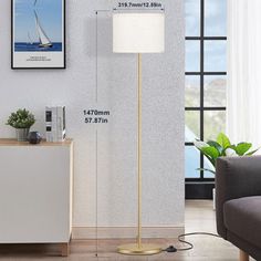 the floor lamp is next to a couch