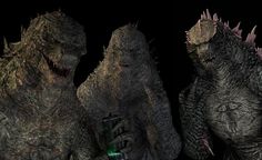 two godzillas are standing next to each other