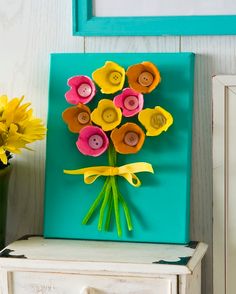 a bouquet of flowers sitting on top of a dresser