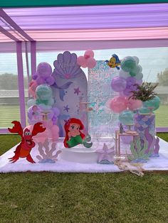 a little mermaid themed birthday party with balloons and decorations