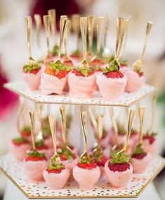 small desserts with strawberries and gold forks