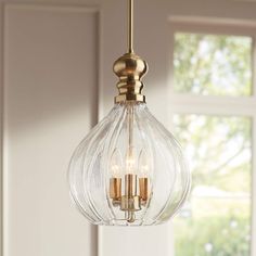 a light fixture hanging from a ceiling in a room