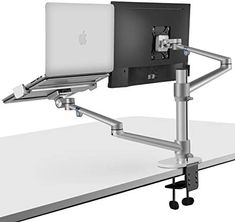 a computer desk with a laptop and monitor on it's back support arm that is attached to the side of the table