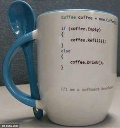 a coffee mug with a spoon in it and some code writing on the inside cup
