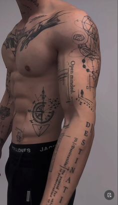 an image of a man with tattoos on his arm and chest, looking at the camera