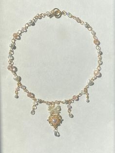 a bracelet with beads and charms on it