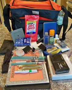 the contents of a travel bag sitting on top of a counter