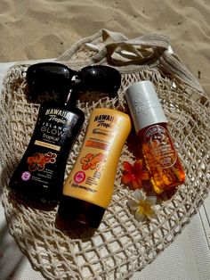 the beach bag is full of sunscreen, body lotion and other beauty products
