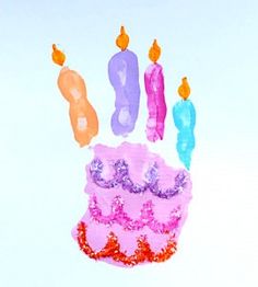 a pink birthday cake with candles on it