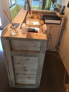 a small wooden desk in the corner of a room