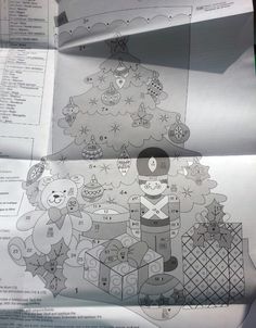 some papers with drawings on them in the shape of christmas trees and teddy bears,