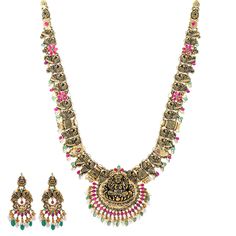 Virani Jewelers' 22k antique gold and gemstone temple jewelry set, a true masterpiece of Indian jewelry. Crafted with intricate precision, this gold necklace and matching earring set exudes cultural elegance. The rustic charm of 22k antique gold seamlessly blends with captivating gemstones, creating a treasure that transcends generations. The detailed depiction of the Goddess Laxmi deity adds divine charm to the set, making it a symbol of spirituality and tradition. Elevate your style with this Goddess Laxmi, Gold Temple Jewellery, Temple Jewelry, Pearl Gemstone, Temple Jewellery, Antique Finish, Rustic Charm, Indian Jewelry, Matching Earrings