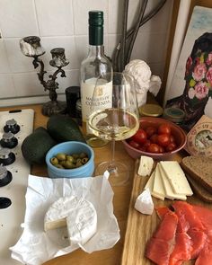 wine, bread and other food are on the counter