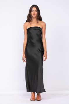 The Irene Black Satin Strapless Maxi Dress is the perfect date night dress! Black satin fabric shapes this strapless maxi dress with a cowl back and a ruched elastic strap. Pair with some gold jewelry and strappy heels for a night out on the town. DETAILS & CARE 95% Polyester/ 5% Spandex Hand wash cold. Imported. ORDERS, SHIPPING & RETURNS Orders, Shipping, & Returns Black Strapless Silk Dress, Black Satin Strapless Dress, Black Strapless Dress Outfit, Long Black Satin Dress, Silk Tube Dress, Strapless Dress Outfit, Black Strapless Maxi Dress, Maxi Dress Strapless, Strapless Silk Dress